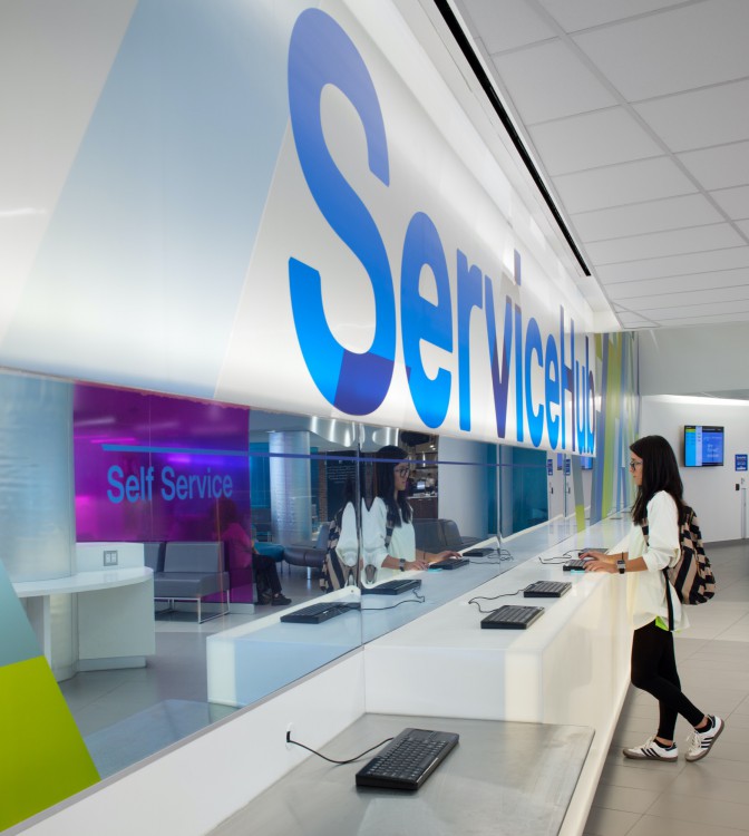 Toronto Metropolitan University Student ServiceHub - Students can self-serve at backlit touchdown bars or checkin at the Info desk