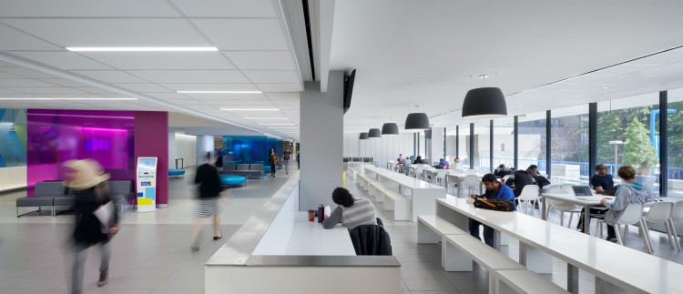 Toronto Metropolitan University Student ServiceHub - Main circulation corridor framed by lounge space and the informal dining and study area